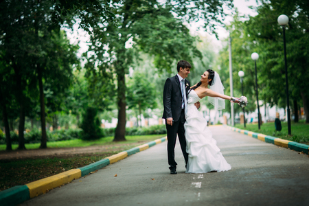 beautiful young couple stand on  background forestの写真素材