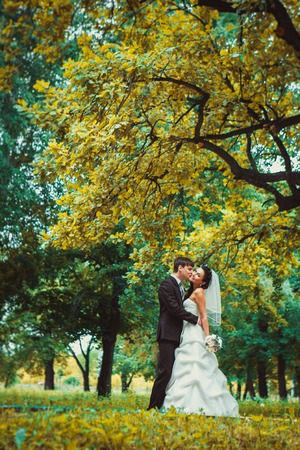 beautiful young couple stand on  background forestの写真素材
