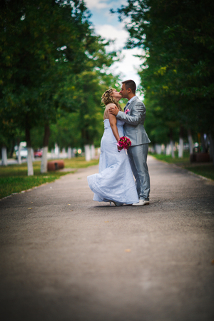 beautiful young couple stand on  background forestの写真素材