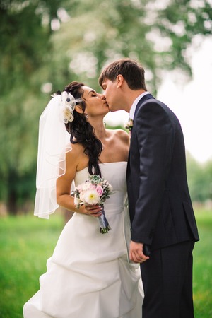 beautiful young couple stand on  background forestの写真素材