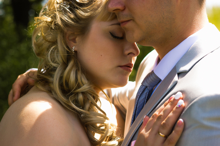 beautiful young couple stand on  background forestの写真素材