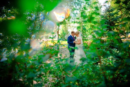 beautiful young couple stand on  background forestの写真素材