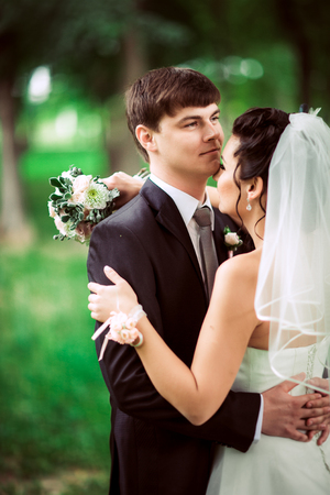 beautiful young couple stand on  background forestの写真素材