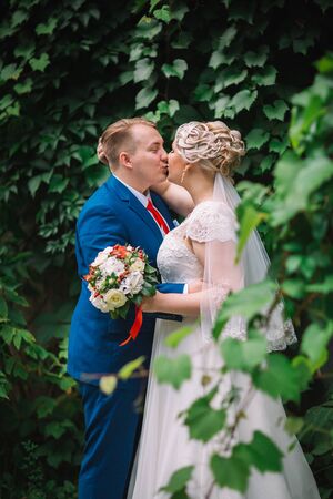 beautiful young couple stand on  background forestの写真素材