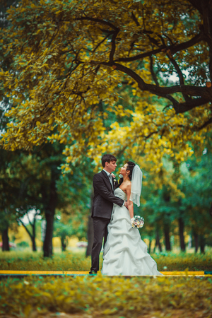 beautiful young couple stand on  background forestの写真素材