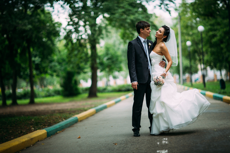beautiful young couple stand on  background forestの写真素材