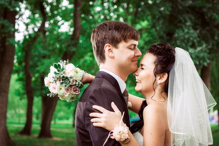 beautiful young couple stand on  background forestの写真素材