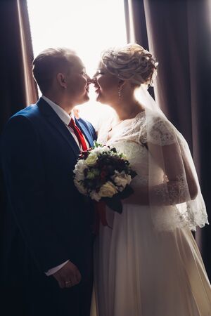 beautiful young couple  stand on a dark backgroundの写真素材