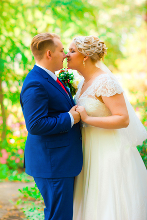 beautiful young couple stand on  background forestの写真素材