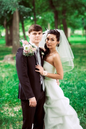 beautiful young couple stand on  background forestの写真素材