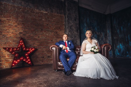 beautiful young  couple suit on a dark backgroundの写真素材