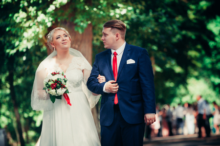 beautiful young couple stand on  background forestの写真素材
