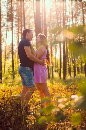 Romantic young couple  laugh on background summer forestの写真素材