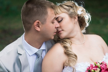 beautiful young couple stand on  background forestの写真素材