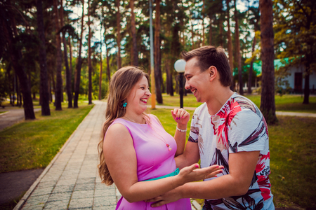 Romantic young couple  laugh on background summer forestの写真素材