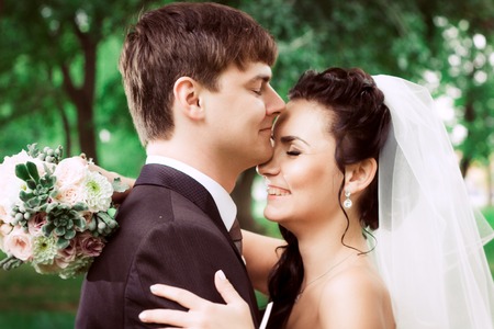 beautiful young couple stand on  background forestの写真素材