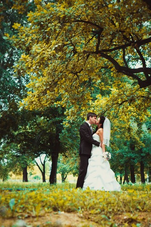 beautiful young couple stand on  background forestの写真素材