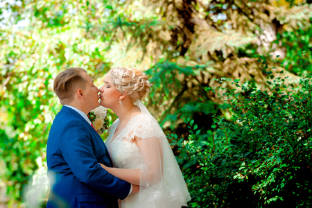 beautiful young couple stand on  background forestの写真素材