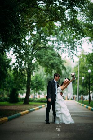 beautiful young couple stand on  background forestの写真素材