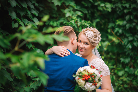 beautiful young couple stand on  background forestの写真素材