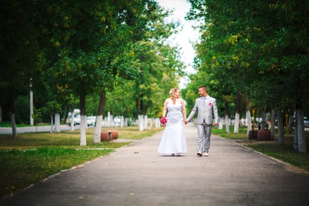 beautiful young couple stand on  background forestの写真素材