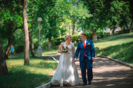 beautiful young couple stand on  background forestの写真素材