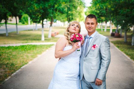 beautiful young couple stand on  background forestの写真素材