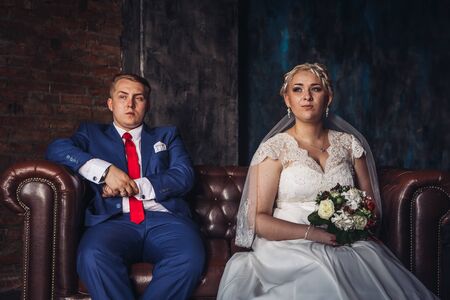 beautiful young  couple suit on a dark backgroundの写真素材