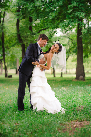beautiful young couple stand on  background forestの写真素材