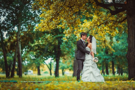 beautiful young couple stand on  background forestの写真素材