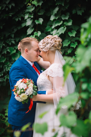 beautiful young couple stand on  background forestの写真素材