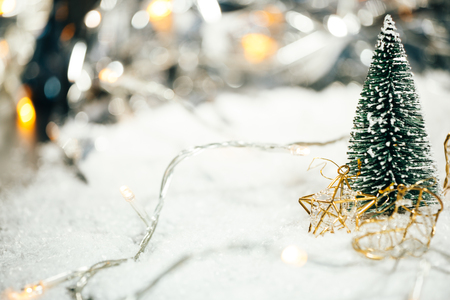miniature Christmas tree in the snow and  decorationsの写真素材