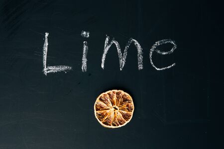 one sliced orange circle on a black background  boardの写真素材