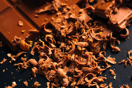 Many candy and chocolate  chips on a black background