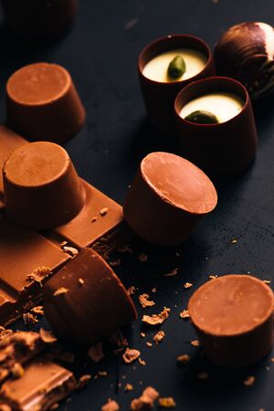Many chocolate sweets with Pistachio on black backgroundの写真素材