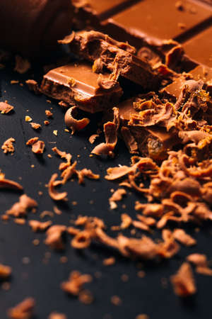 Many candy and chocolate  chips on a black background