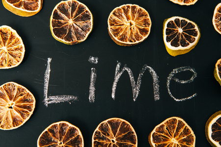 many cut orange  circle on a black background boardの写真素材