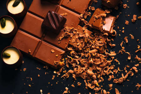 Many candy and chocolate  chips on a black backgroundの写真素材