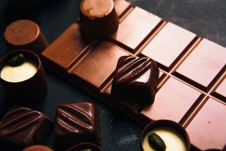 Many chocolate sweets with Pistachio on black backgroundの写真素材
