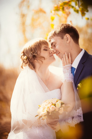 young bride and groom on  the bluer backgroundの写真素材