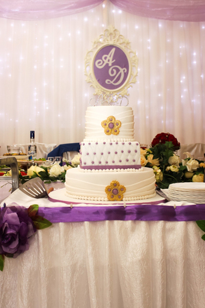Beautiful multi-tiered wedding cake with  purple tonesの写真素材