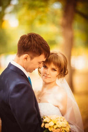 young bride and groom on  the bluer backgroundの写真素材