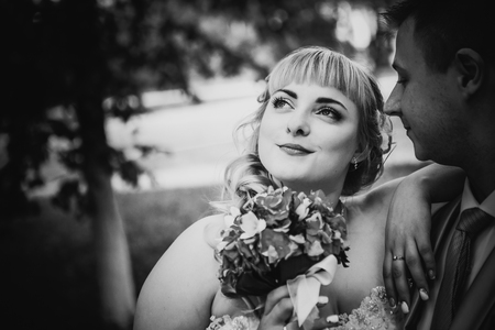 Black white  photography  beautiful wedding young couple stand on  background forestの写真素材