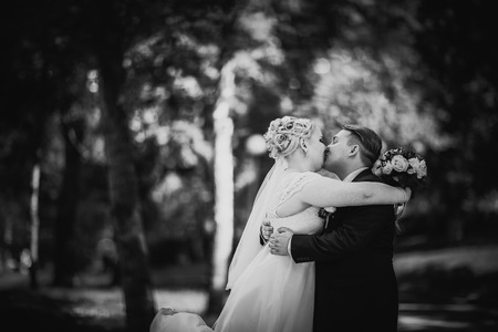 Black white  photography beautiful young couple stand on  background forestの写真素材