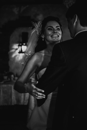 Black white photography  beautiful young couple stand on  background cafeの写真素材