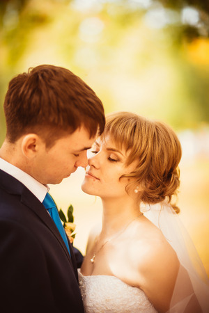 young bride and groom on  the bluer backgroundの写真素材