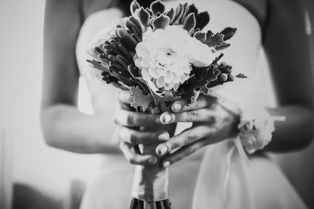 Black white photography beautiful wedding bouquet  of flowers in hands  the brideの写真素材