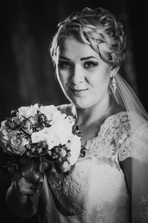 Black white  photography portrait of  bride  on the classic dark backgroundの写真素材