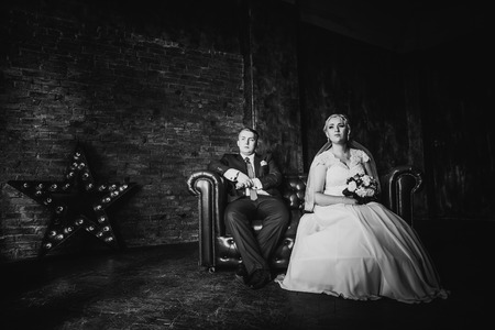 Black white  photography  beautiful young  couple suit on a dark backgroundの写真素材