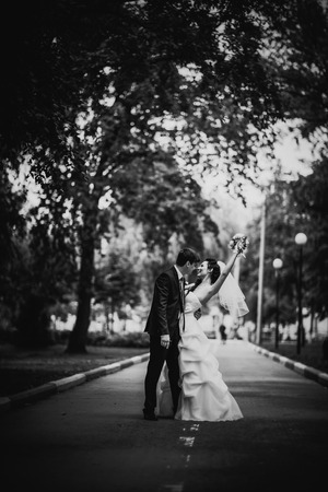 Black white photography beautiful young couple stand on  background forestの写真素材